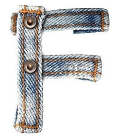 the letter f is made out of jeans and has metal buttons on it's side