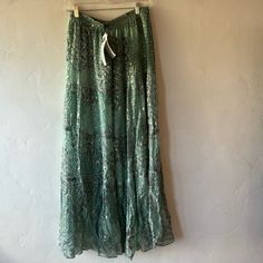 Beautiful Green With Gold Tiered Skirt. Lined, Elastic Waist.Nwt. Bohemian Silk Bottoms For Summer, Spring Bohemian Silk Maxi Skirt, Bohemian Silk Maxi Skirt For Spring, Bohemian Silk Skirt For Spring, Bohemian Flowy Bottoms For Party, Fitted Silk Bohemian Bottoms, Green Silk Bottoms For Summer, Bohemian Long Silk Skirt Bottoms, Bohemian Silk Long Skirt Bottoms