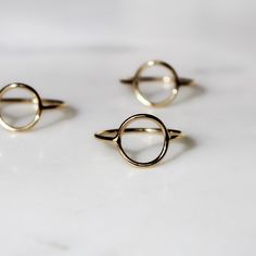 The Open Circle Stacking Ring features an open circle on a smooth, gold-filled band. Available in whole sizes 5-9. Material: 14k Gold Filled Band Width: 1mm Open Circle Width: 10mm Hypoallergenic. Water friendly. Nickel & lead free. What does Gold-Filled mean? Gold filled jewelry contains 1/20th (5%) of real gold content, or more than 100x real gold content that most gold plated jewelry. The process to make gold-filled jewelry includes pressure heat-bonding the gold to underlying base metal. It 14k Gold Midi Rings For Everyday, Adjustable Round Midi Rings In Recycled Gold, Adjustable Recycled Gold Midi Rings, Hypoallergenic 14k Gold Round Midi Rings, Modern Hypoallergenic 14k Gold Rings, Everyday Gold Midi Rings, Simple 14k Gold Filled Round Rings, Minimalist Stackable 14k Gold Filled Rings, Everyday Gold Circle Midi Rings