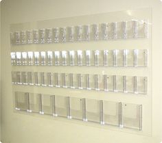 there are many clear plastic containers on the wall