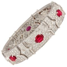 The ruby and diamond cuff bracelet features 6 oval cut rubies of pigeon blood color and crystalline texture for a total of 11.54 carats. The design is set with 11.25 carats of round diamonds en pavé, and 2.75 carats of princess cut diamonds decorating the bridges between the sections. All our diamonds are of top quality (F/G-VVS, color, clarity, and cut). Please note the extraordinary workmanship manifested in the ideal level of articulation. The bracelet is one-of-a-kind. It was entirely handma Ruby Diamond Bracelet, Blood Ruby, Diamond Cuff Bracelet, Tiaras Jewellery, Ruby Bracelet, Antique Bracelets, Gold Bracelet Cuff, Bracelet Design, Expensive Jewelry