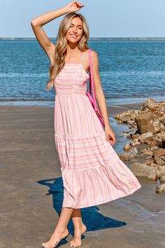 Celebrate warm days with our Pink Variegated Stripe Square Neck Maxi Dress. This delightful dress features a playful mix of pink variegated stripes that add a pop of color and visual interest. The square neckline complements the elongated silhouette, making it a perfect choice for beach outings, casual gatherings, or just a leisurely day out. Product code: CAA05A4E127DC Features:  Woven Square neckline Sleeveless Maxi Pattern: Stripes Wash Method: Regular Wash Material: 100%POLYESTER. Pink Square Neck Maxi Dress For Vacation, Pink Square Neck Casual Maxi Dress, Casual Pink Square Neck Maxi Dress, Casual Pink Maxi Dress With Square Neck, Pink Sundress With Square Neck, Pink Square Neck Sundress Maxi, Pink Square Neck Maxi Dress For Day Out, Pink Vertical Striped Summer Dress, Pink Vertical Stripe Summer Dress