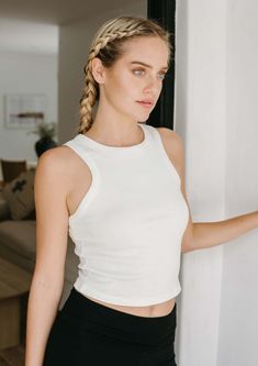 The Bliss Rib Tank is the go-to tank for any look. Whether you're styling it with yoga pants, jeans, or a skirt, its ultra-soft Airlume cotton and mid-length cut provide a comfortable, stretchy fit that perfectly frames your body. Plus, the timeless high-neck and racerback silhouette make it a staple style for any wardrobe. FitThis style runs true to size. 19" long measuring from a small. Size range = XS 0-2, S 2-4 M 6-8, L 10-12, XL 14-16. FabricMoisture wicking, ultra soft micro rib jersey, 52 Crochet Tank Top, Tank Top Dress, A Skirt, Muscle Tanks, Pants Jeans, Yoga Leggings, Classic White, Crop Tank, Everyday Look