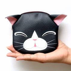 Black cat coin purse .  Bag size is approximately 12x12.5cm.Sew the lining with a soft sponge.Hand- painted technique with high quality paints on synthetic leather,exquisite sewing . The zipper and back of every bag in the store is dark brown. The coin purse and small gift will be sent as soon as possible after confirming your payment.   There are other items that you may like in our shop.Please visit our shop to see the different designs available.  https://www.etsy.com/shop/Pipobypimprapa?ref= Cute Cat Design Coin Purse For Everyday Use, Cute Cat Design Coin Purse For Everyday, Cute Everyday Cat Design Coin Purse, Black Pouch Coin Purse, Black Portable Pouch Coin Purse, Portable Black Pouch Coin Purse, Cat Design Pouch Bag As Gift, Cute Black Coin Purse As Gift, Cute Black Coin Purse For Everyday