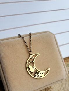 Crescent Moon Pendant This Halloween pendant is a great piece of jewelry to add to your collection or gift to that special someone in your life. Pendant: ~ Gold ~ Raw brass ~ Nickel, Lead and Cadmium free ~ Size: 25mmx33mm Chain: ~ Antique Gold   ~ Choose Your Chain Length During Checkout. 👉 Link to Our STOREFRONT: https://www.etsy.com/shop/FashionCrashJewelry?ref=shopsection_shophome_leftnav&ga_search_query=crystal%2Bnecklace Our Motto ~ Happy Customers Are Awesome 🌞Let us know of any problem Moon Shaped Brass Necklace For Gift, Moon-shaped Brass Necklace For Gift, Half Moon Metal Necklace For Gifts, Half Moon Metal Necklace For Gift, Magical Sun And Moon Design Necklace Gift, Magical Sun And Moon Design Jewelry As Gift, Magical Moon Shaped Jewelry For Gifts, Magical Moon Shaped Jewelry Gift, Magical Moon-shaped Jewelry For Gifts