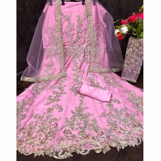 This pink colored anarkali suit is beautifully adorned with zari embroidered and sequins work as shown. This net anarkali suit comes along with semi stitched satin bottom, lining and net dupatta which makes it appear more adorning. Women can buy this suit to wear for their party, sangeet, homely events and ideal for any fashionista. Note:- The actual product may differ slightly in color and design from the one illustrated in the images when compared with computer or mobile screen. Size Chart Size: Semi Stitched/Unstitched can be altered from maximum to minimum size based on size chart Pink Semi-stitched Anarkali Set For Festivals, Pink Anarkali Set With Dori Work, Pink Anarkali Set For Diwali, Pink Anarkali Set With Zari Work, Pink Anarkali Set For Eid, Semi-stitched Pink Anarkali Set With Dori Work, Pink Semi-stitched Anarkali Set With Dori Work, Pink Anarkali Churidar For Diwali, Pink Bollywood Gown With Dori Work