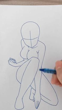 someone is drawing a female figure on paper