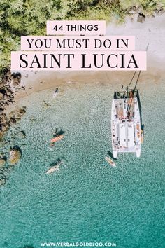 an aerial view of a boat in the ocean with text overlay that reads, 44 things you must do in saint lucia