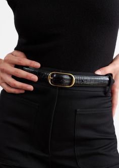 Nili Lotan's Reine Belt is a 25mm straight belt in embossed Italian leather with a solid brass buckle in antique gold finish. A classy and elegant piece to add to any outfit. 100% Italian Croc Embossed Leather Size 75: 75cm to 3rd hole, total length is 90cmTotal Length: 35" Size 80: 80cm to 3rd hole, total length is 95cm Total Length: 37" Size 85: 85cm to 3rd hole, total length is 100 cm Total Length: 39'' Spot clean only Made in Italy Nili Lotan, Classy And Elegant, Fully Fashioned, Jean Top, Belt Black, Brass Buckle, Knit Tank, Short Jumpsuit, Leather Care