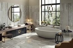 an elegant bathroom with marble walls and flooring