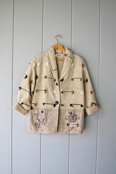 90s Oversized Textile Jacket | Woven Linen Cotton Spring Coat | Vintage Fringe & Embroidery Oat Blazer | Long Boho Jacket Winter Cream Cotton Blazer, Vintage Embroidered Outerwear For Work, Embroidered Long-sleeve Cotton Blazer, Embroidered Long Sleeve Cotton Blazer, Embroidered Cotton Long Sleeve Blazer, Embroidered Cotton Blazer With Long Sleeves, Cream Embroidered Cotton Outerwear, Vintage Embroidered Beige Outerwear, Vintage Beige Embroidered Outerwear