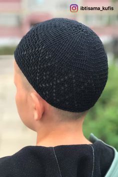 the back of a person's head wearing a black knitted hat