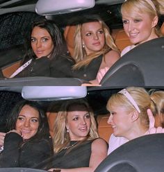 three women sitting in the back seat of a car