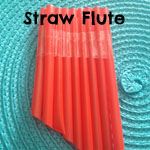 an orange straw tube sitting on top of a blue mat with the words straw flute