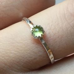 Handcrafted Sterling Silver Mini Peridot Stacking Ring Featuring A Hammered Sterling Silver Band And A Genuine Peridot Gemstone. Available In Any Size From 1-16 Including Quarter, Half And Whole Sizes! If You Don’t See Your Size, Just Let Me Know And I Can Add It To The Listing And Make It For You! Since This Ring Is Handmade To Order, Please Allow A Few Days To Make A Ring Just For You Green Sterling Silver Stackable Jewelry, Green Gemstone Stackable Rings In Sterling Silver, Silver Faceted Peridot Jewelry, Silver Dainty May Birthstone Ring, Handmade Green Sterling Silver Birthstone Ring, Green Dainty Stackable Rings, Dainty Silver Jewelry, Silver Smithing, Hammered Sterling Silver