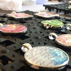 several different colored pendants sitting on top of a table