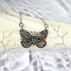 ✨️FREE SHIPPING (USPS First-Class Mail ONLY) and will ship out in ONE BUSINESS Day ✨️ Elevate Your Style with a Touch of Vintage Elegance Unveiling our mesmerizing Steampunk Butterfly Necklace, a masterpiece that transports you to an era of whimsical charm and mechanical marvels. Crafted with meticulous attention to detail, this one-of-a-kind necklace captures the essence of steampunk with its intricate gears, antique finishes, and dazzling crystal accents. At the heart of this piece lies a grac Handmade Black Steampunk Necklace, Vintage Handmade Butterfly Necklace, Handmade Adjustable Steampunk Necklace, Adjustable Handmade Steampunk Necklaces, Handmade Steampunk Jewelry For Festivals, Dragonfly Jewelry Necklace, Steampunk Butterfly, Dragonfly Jewelry, Jewellery Unique