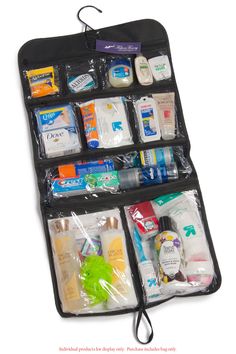 an open travel bag filled with toiletries and personal care items on a white background