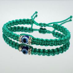 Fashionable And Durable Hand-Made Aqua Green String Bracelet With An Evil Eye For Wrist Sizes 6 To 9 Inches, With An Easy To Use Zip Like Function To Fit Your Wrist, You'll Have It On As Soon As You Get It. Made From High Quality Aqua Green String, It Will Be Sure To Last. Wearing An Evil Eye As An Amulet Is Believed To Provide Protection Against Evil Forces. The Evil Eye Meaning Has Symbolism In Almost Every Country In The World And In Every Religion. Each Bracelet Is Carefully Handcrafted And Adjustable Green Evil Eye Bracelet As Gift, Adjustable Green Bracelet, Adjustable Green Evil Eye Spiritual Bracelet, Adjustable Green Spiritual Evil Eye Bracelet, Green Adjustable Spiritual Evil Eye Bracelet, Green String Bracelet, Evil Eye Meaning, Protection Against Evil, Eye Meaning