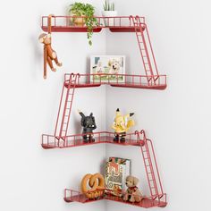 three red shelves with stuffed animals, toys and books on them against a white wall