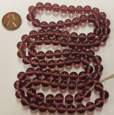 "You will receive 100 Pieces Vintage Japanese 1950's Cherry Brand Glass Amethyst Smooth Round Handmade Beads On Temporary String. \"Made In Japan\" Tag May Not Be Included. Circa Late 1940's To Early 1950's. Each Handmade Bead Is Unique And May Vary In Size & Color Slightly Beads measure 8mm. Round (Hole To Hole Bead Measurement Is 7.5mm.) Approx. .5mm. New Unused Vintage Stock - NOS - New Old Stock. More beautiful Vintage Cherry Brand Beads.... Click below: https://www.etsy.com/shop/MLRober Vintage Cherry, Thanks A Bunch, Handmade Beads, Vintage Copper, Bead Caps, Vintage Japanese, Round Beads, Coupon Codes, Cherry