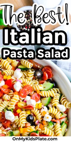 Close up in a bowl of pasta, olives, cucumber, pepperoni , cheese and other vegetables with text title overlay Best Italian Pasta Salad, Best Italian Pasta, Vegetarian Salad Recipes, Best Pasta Salad