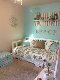 a bedroom with a bed, dresser and other items on the floor in front of it