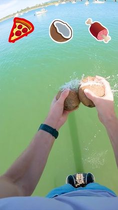 a man is sitting on a boat in the water with food floating around him and his hands are held up