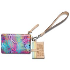 WHAT MAKES IT RIDICULOUSLY AWESOME The Combi, a combination of on-the-go accessories, is a new way to carry your keys, cards, and the small stuff together or separately. This colorful wristlet wallet includes a pocket pouch, secure card slot wallet and fits comfortably around your wrist - ready for your next journey. DETAILS & SIZING Steph ConsuelaCloth™ exterior Diego leather five-slot card wallet with D-ring Graphite gray glitter wristlet Trimmed in natural, untreated leather 5” (H) x 8” (W) P Wristlet Patterns, Mexico Style, Small Stuff, Card Organizer, Bag Tag, Gift Boutique, Wallet Accessories, Wristlet Wallet, Luggage Accessories