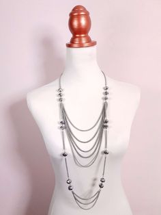 This vintage pre-loved Y2K necklace features a long multi-tiered design made up of stylish, interspersed faceted grey glass beads and draped multi-roped chains. Finished with an extender and lobster claw clasp. Era - Y2K early 2000s Materials - Silver coloured metal and glass beads 52cm to 55cm drop 12mm Bead width Excellent condition Early 2000s Necklaces, 2000s Necklace, Early 2000s Jewelry, Couture Aesthetic, 2000s Jewelry, 20s Style, Tiered Necklace, Y2k Necklace, 20s Fashion