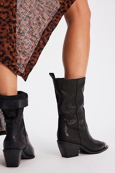 It’s all in the details with these slouchy, Western-inspired boots, featured in a mid-calf length with a soft pebbled leather upper and filigree toe cap for the perfect hint of shine. **Features:** Mid-calf length, slouchy style, pull-on design, pointed toe, filigree metal toe cap, chunky block heel **Why We | Faster Horses Filigree Boots by FP Collection at Free People in Black, Size: US 8.5 Spring Leather Knee-length Boots, Leather Knee-length Boots For Spring, Knee-length Leather Spring Boots, Spring Knee-length Leather Boots, Leather Knee-length Boots For Fall, Wide Calf Leather Moto Boots, Leather Wide Calf Mid-calf Moto Boots, Wide Calf Leather Mid-calf Moto Boots, Leather Wide Calf Moto Boots Mid-calf