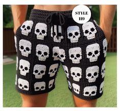 a man wearing shorts with skulls on it and the words style 19 written in white