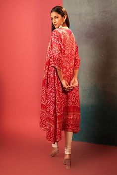 Red kurta with bandhani woven motifs and gota embroidered neckline. Paired with embroidered dupatta.
Components: 2
Pattern: Woven, Embroidery
Type Of Work: Bandhani, gota
Neckline: U neck
Sleeve Type: Three quarter
Fabric: Silk
Color: Red
Other Details: 
Cutwork border
Attached lining
Kurta Length: 47 inches
Note: Pant worn by the model is not for sale
Occasion: Sangeet - Aza Fashions Woven Embroidery, Kurta With Dupatta, Red Kurta, Embroidered Dupatta, Embroidered Neckline, Fabric Silk, U Neck, Red Silk, Cut Work