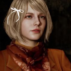 a close up of a person wearing a scarf and an orange shirt with a bow on it