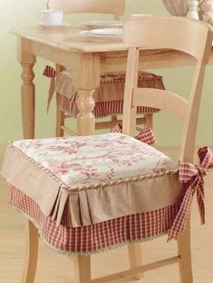 a wooden chair with a plaid seat cover on it