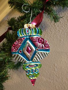 an ornament hanging from a christmas tree