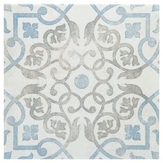 a white and blue tile with an intricate design