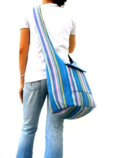 "This Beautiful Light Blue Multi color Bag This is a convenient very comfortable colorful bag and suitable for everyone. Multi color Light Blue Cross Body Shoulder Bag Top zipper closure with Front zipper pocket This bag is fully black lined interior This bag is 100% cotton Measurements Size (Approx): Length: 15\" Height: 17\" Width: 7\" Strap Drop: 45\" Color : Multi color Light Blue Please Visit our store: https://www.etsy.com/shop/Avivahandmade Thank You For Watching" Casual Handwoven Shoulder Bag For Festivals, Bohemian Canvas Bag With Large Capacity For Everyday, Bohemian Canvas Bag With Adjustable Strap For Travel, Bohemian Blue Bucket Bag With Adjustable Strap, Blue Bohemian Bucket Bag With Adjustable Strap, Bohemian Large Capacity Canvas Bag For Everyday Use, Bohemian Canvas Travel Bag With Adjustable Strap, Colorful Bohemian Tote Shoulder Bag, Hippie Rectangular Hobo Bag With Adjustable Strap