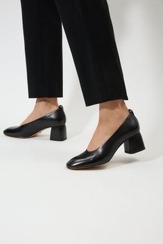 Pre-order with 20% off until August 20th Ships out on August 26th Heel height 2.4in Genuine leather Lining - Calf leather Crafted from high-quality materials, Georgia heels feature a sleek, timeless design that complements any outfit. The pointed-toe silhouette adds an elegant touch, while the sturdy block heel provides stability and all-day comfort. The smooth, supple upper ensures a luxurious feel, making these heels a standout addition to your collection. Leather Court Shoes With Low Heel For Office, Office Leather Shoes With Almond Toe And Branded Heel, Office Court Shoes With Low Heel And Leather Sole, Office Leather Shoes With Contrasting Low Heel, Office Leather Shoes With Padded Low Heel, Medium Width Almond Toe Leather Shoes For Office, Square Toe Block Heels With Padded Heel For Work, Stacked High Heel Block Heels For Office, Office Block Heels With Stacked High Heel