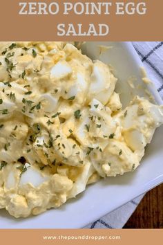 an egg salad in a white bowl with the words zero point egg salad