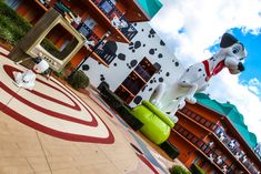 a large dalmatian dog statue in front of a building