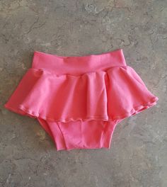 "Jersey knit skirted bummies, diaper cover bloomers Shorts Stretch cotton / spandex fabric for comfort. All skirted bummies will be made like the first picture. Waist size before stretch: Newborn: 12-13\" (up to 8 lbs) 0-3 Months W: 14\" 3-6 Months W: 16\" 6-12 Months W: 16.5\" 12-18 Months W: 17\" 18-24 Months W17.5\" 2T W: 18\"-19\" Feel free to send me your child's exact measurements and I can customize the waist or length to their specific size. *Please note, pattern placement may vary, and Cute Fitted Bottoms With Elastic Waistband, Cute Fitted Shorts With Elastic Waistband, Cute Fitted Bottoms With Built-in Shorts, Fitted Cotton Bloomers With Elastic Waistband, Fitted Bottoms With Built-in Shorts In Cute Style, Cute Pink Short Bloomers, Cute Short Pink Bloomers, Fitted Cotton Bloomers With Ruffles, Cute Pink Bloomers With Elastic Waistband