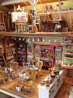 a room filled with lots of furniture and books