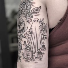 a woman with a tattoo on her arm has a black and white image of a ghost