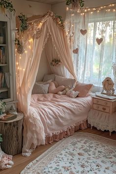 a bedroom with a pink canopy bed and lots of fairy lights hanging from the ceiling