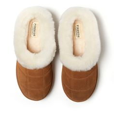 Trust us: they're as cozy as they look. With genuine shearling offering all over comfort and genuine suede providing proven indoor/outdoor durability, these clogs are a must for relaxing anytime, anywhere. Adorned with quilted details and a plush cuff, you're sure to stay cozy with these memory foam clogs. Comfortable Brown Shearling Slippers, Brown Shearling Indoor Slippers, Winter Shearling Slippers With Textured Footbed, Winter Brown Shearling Clogs, Winter Sheepskin Slippers With Suede Lining, Shearling Slippers With Plush Lining, Brown Shearling Clogs For Winter, Winter Suede Slippers With Cushioned Footbed, Brown Shearling Slippers With Faux Fur Lining