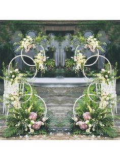 an outdoor wedding arch with flowers and greenery