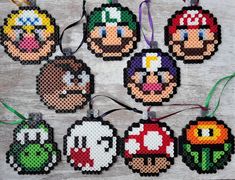 cross stitch ornament ornaments with mario bros characters on them, all in different colors