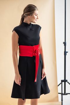 "A modern qipao dress featuring fit and flare silhouette, high neck mandarin collar and a midi length. - chinese (modern cheongsam) style - stand collar - short cap sleeves - skater pleated skirt - fabric buttons decoration - a-line silhouette - lined bodice - midi (Knee) length - concealed back zipper closure Fiber: 40% viscose, 55% polyester, 5% elastane Lining: 95 % viscose, 5 % elastane Color: black For size S: length- 40,5\" (103 cm) Our model wears size S (US 6) and is 171cm/5'6\" tall. Yo Chic Black Dress With Stand Collar, Elegant Spring Dress With Band Neckline, Elegant Stand Collar Dresses For Summer, Elegant Stand Collar Summer Dresses, Elegant Fitted Knee-length Cheongsam, Elegant Knee-length Fitted Cheongsam, Elegant Summer Dresses With Stand Collar, Elegant Knee-length Cheongsam For Formal Occasions, Elegant Black Cheongsam For Spring