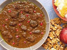 Fesenjān—an iconic Persian braise—gets its signature sweet-and-sour flavor from a heavy hit of pomegranate molasses and its velvety texture from ground walnuts.